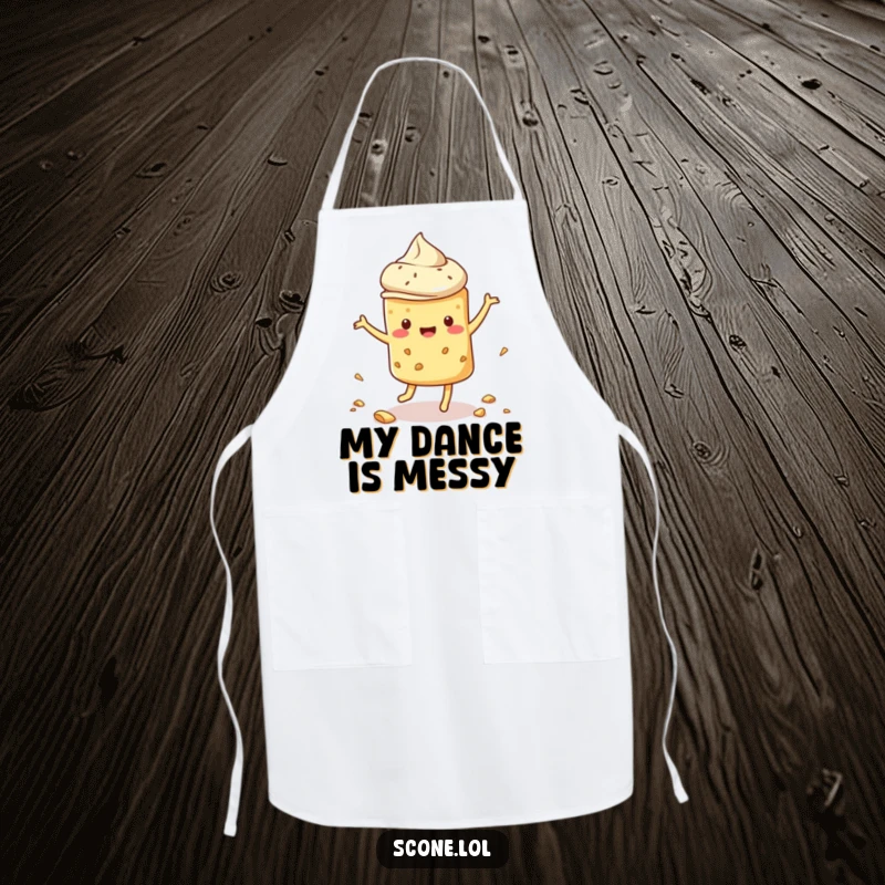 Funny scone apron designed with a scone doing a silly dance and scattering crumbs, bringing humor to any kitchen task.
