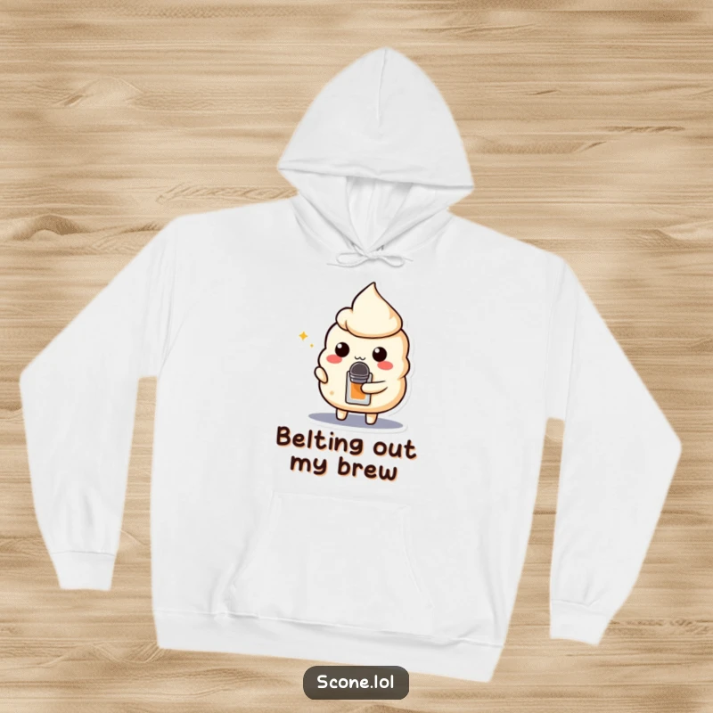 Funny hoodie featuring a scone character holding a teabag microphone, ready to deliver a show-stopping performance.