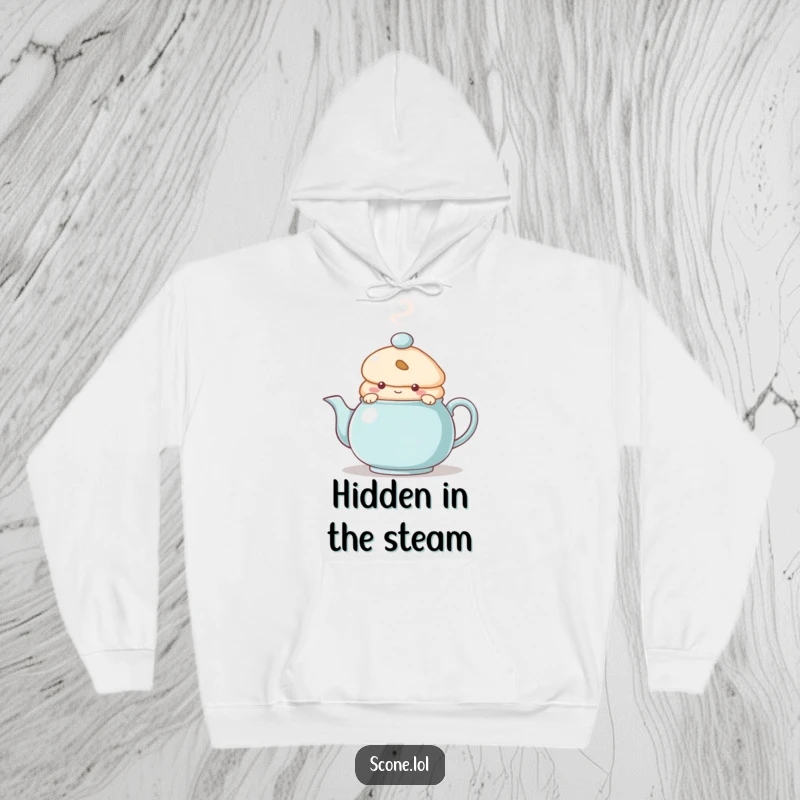 Funny Hoodie featuring a scone character peeking from behind a steaming teapot, symbolizing warmth, coziness, and playful secrets.