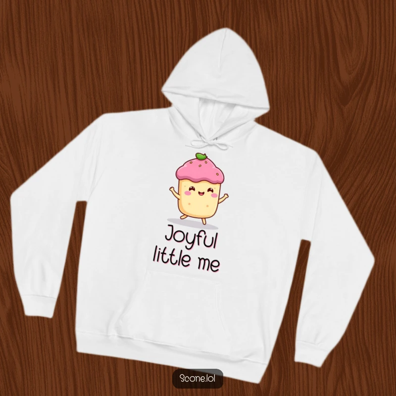 Funny hoodie with a smiling scone character captured in a happy bounce, offering comfort and baked good cheer.