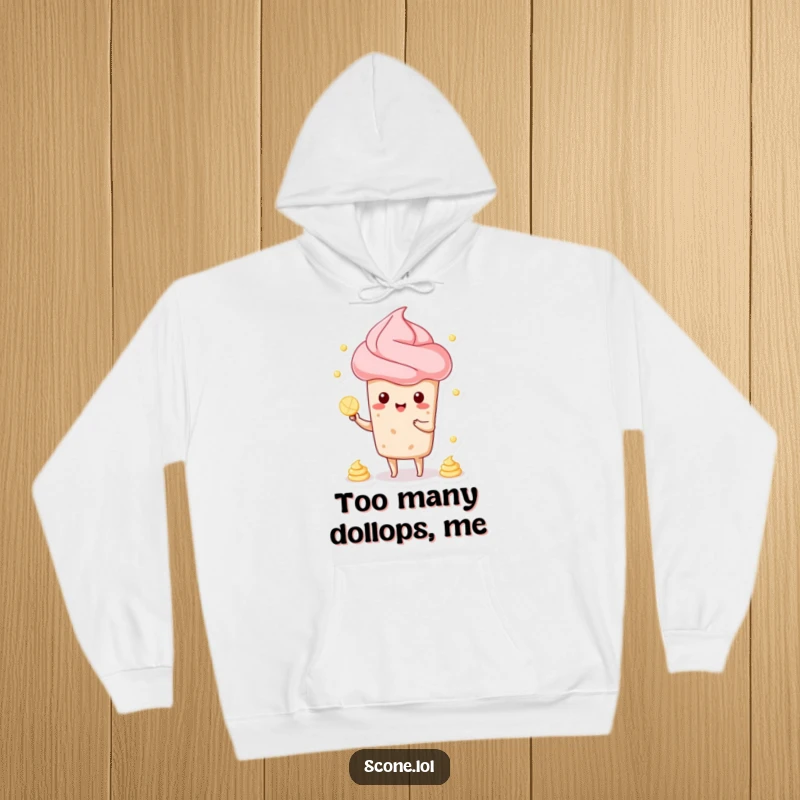 Funny hoodie showcasing a cheerful scone character effortlessly juggling dollops of cream, perfect for cozy, humorous moments.