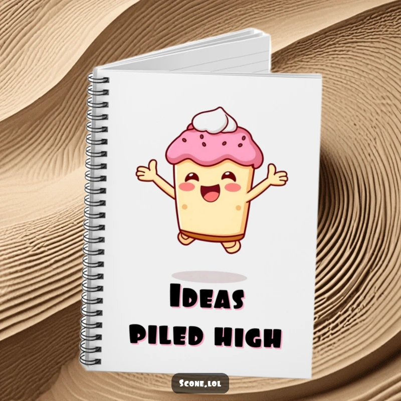 Funny scone character jumping joyfully, holding cream, featured on the cover of this humorous notebook.