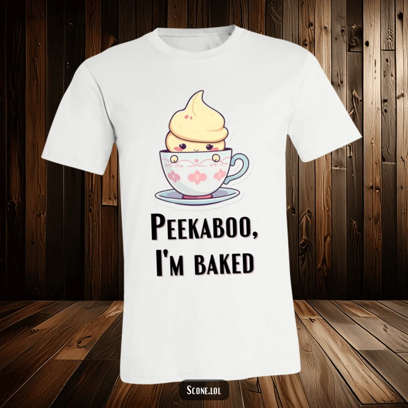 Funny t-shirt featuring a cute scone character subtly peeking from behind a teacup graphic, embodying sweet mischief.
