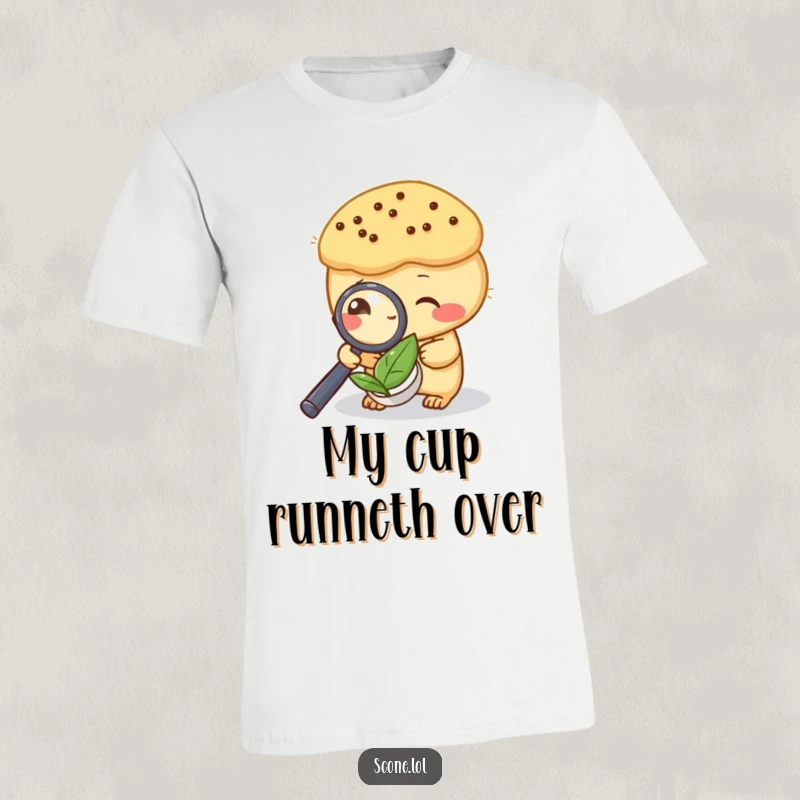 Funny t-shirt featuring a scone intently examining a tea leaf with a magnifying glass, a charming tea sleuth design.