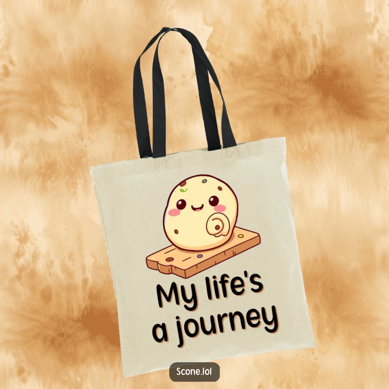Funny tote bag featuring a scone rolling down a pastry board, a cute and humorous accessory for carrying goods.